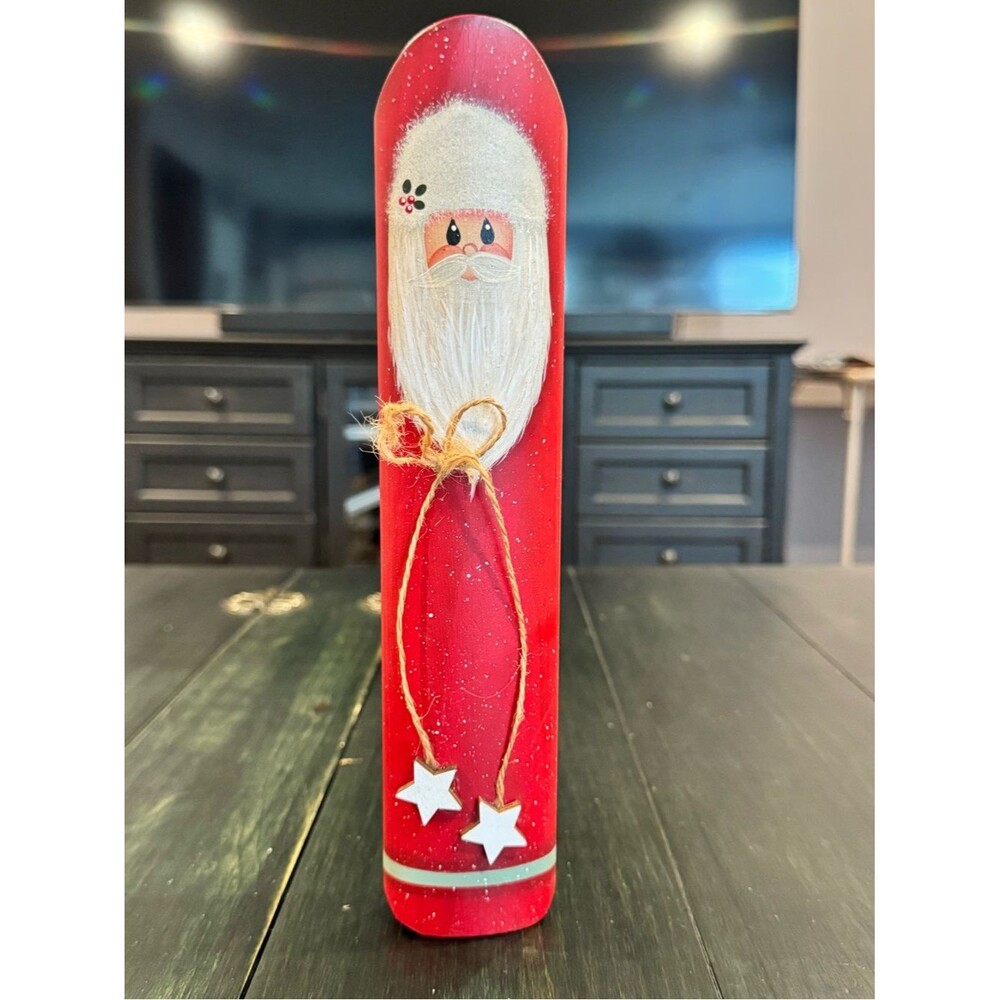 Handcrafted wooden folk art Santa Claus figure